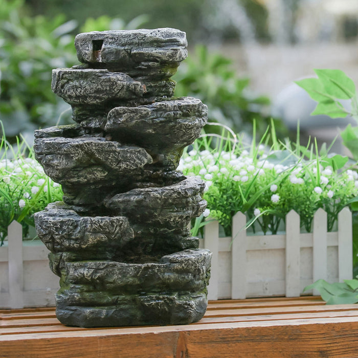 Indoor Stone-Look Water Fountain, 7 Tier Polyresin Cascading Rock Tabletop Fountain With LED Light - Gray